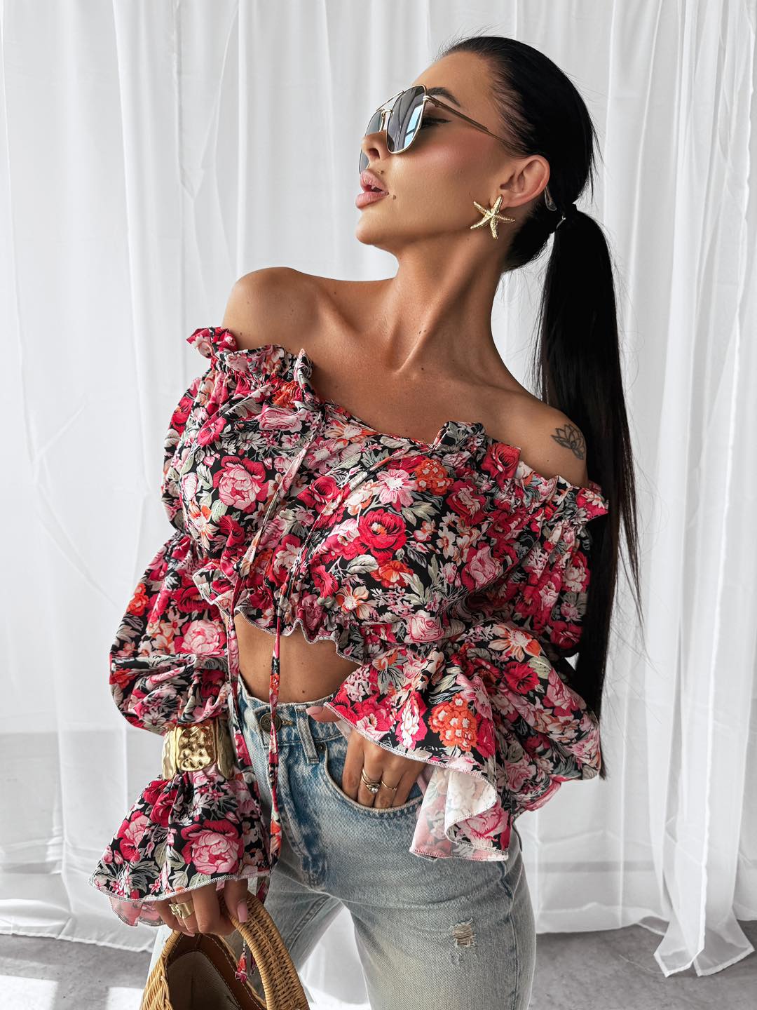 Women’s off-shoulder blouse with long sleeves and floral print